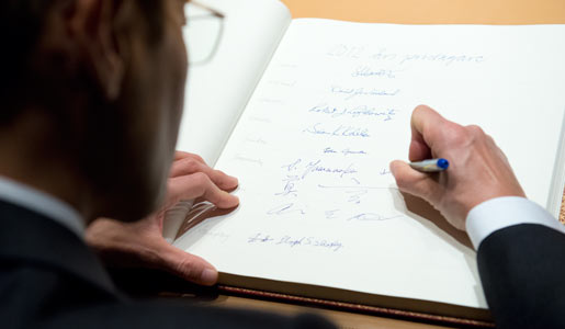 Shinya Yamanaka visits the Nobel Foundation on 12 December 2012 and signs the guest book